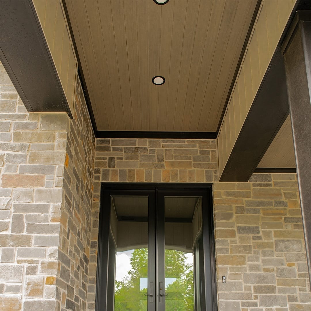 light brown composite wood ceiling planks on front porch