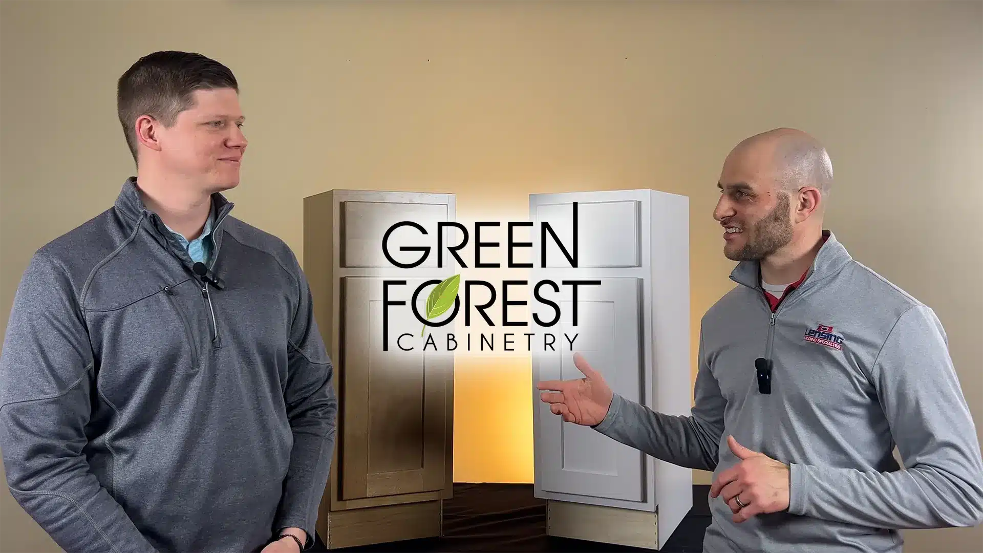 two adult males talking about green forest cabinetry