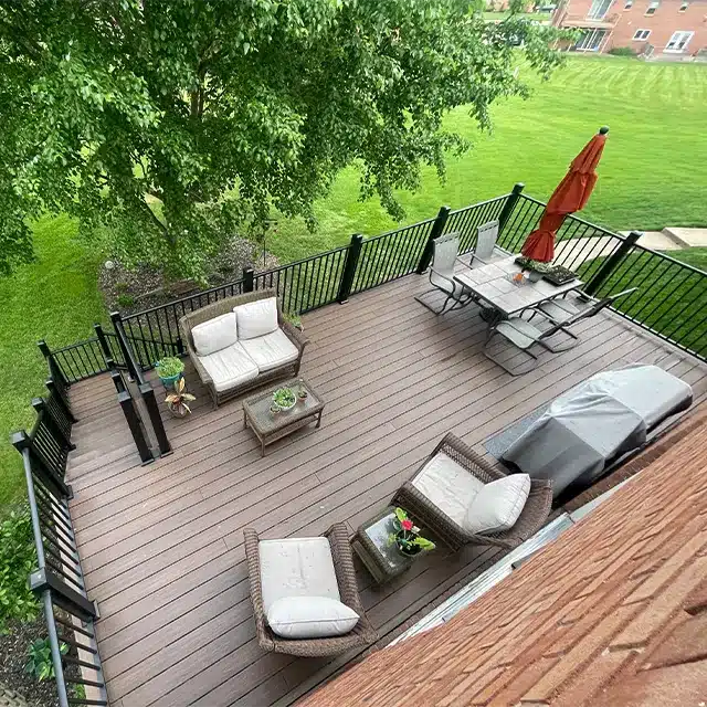 bird's-eye view of a backyard deck with black railing