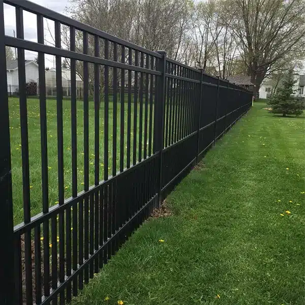 closeup of black flat top aluminum railing from digger specialties and courtyard