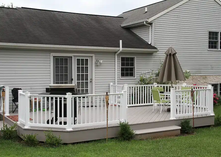 backyard deck with white vinyl railing