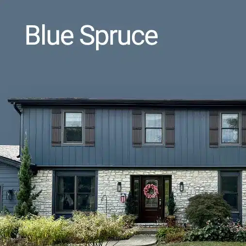 two story home with blue spruce composite siding