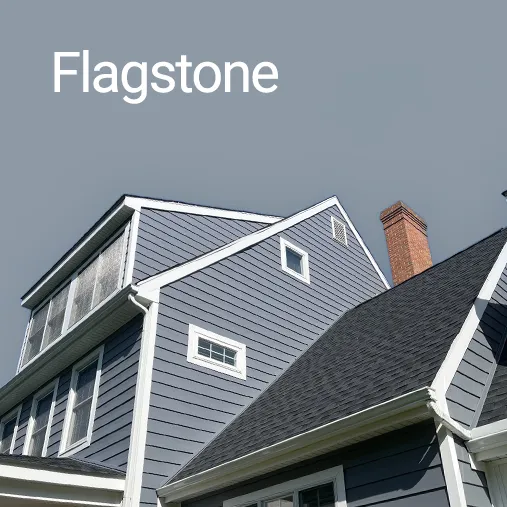 colonial style home with flagstone everlast siding