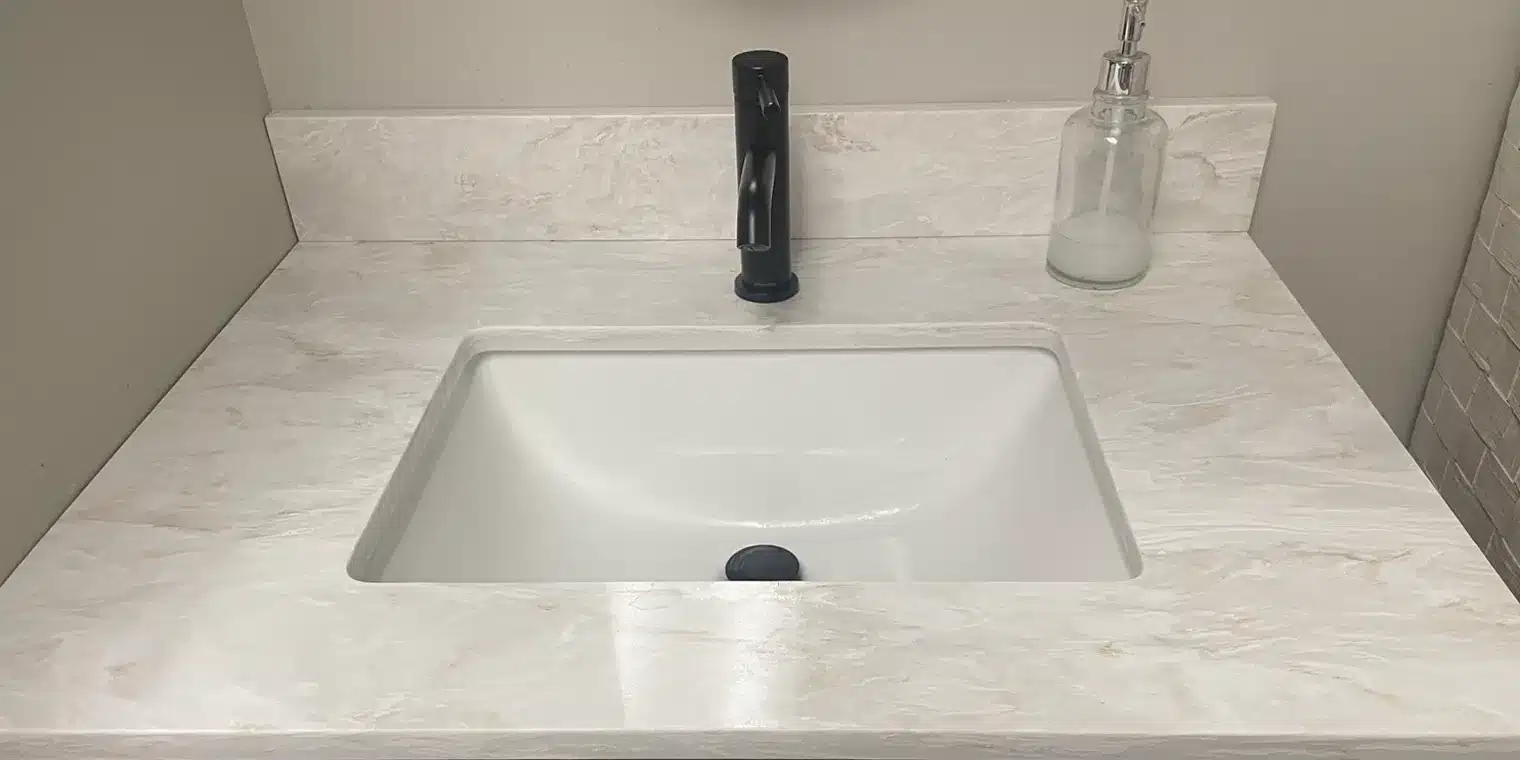 quartz vanity top with black faucet