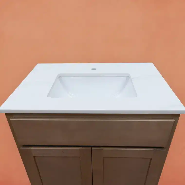 overview of smoked cashew stained cabinet with cream vanity top