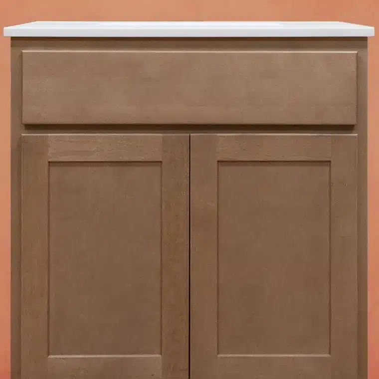 front side of smoked cashew stained cabinet with cream vanity top