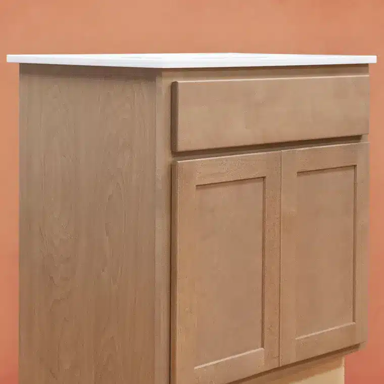 side view of smoked cashew stained cabinet with cream vanity top