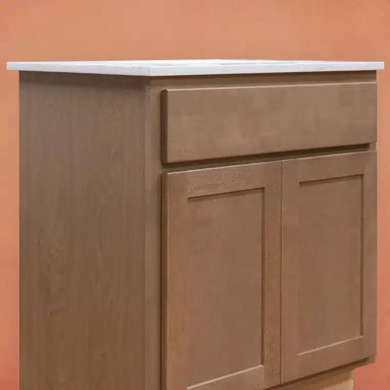 side view of smoked cashew stained cabinet with off white vanity top