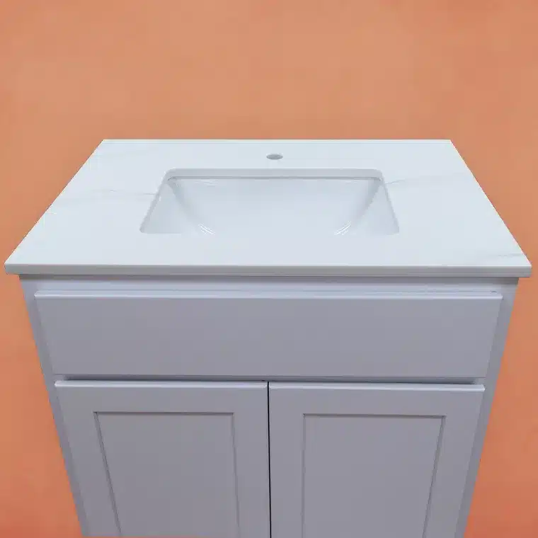 overview of white cabinet with cream vanity top