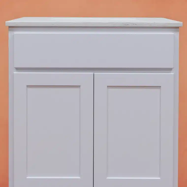 front side of white cabinet with off white vanity top